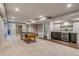 Basement featuring a billiards area, wet bar with beverage cooler, and neutral decor at 3937 Osceola St, Denver, CO 80212