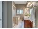 En-suite bathroom boasting a glass shower, soaking tub, dual sinks, and modern fixtures at 3937 Osceola St, Denver, CO 80212