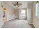 Bedroom featuring neutral paint, neutral carpet, and a ceiling fan with light fixture at 3937 Osceola St, Denver, CO 80212