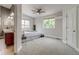 Well-lit bedroom featuring neutral walls, ceiling fan, and plush carpet at 3937 Osceola St, Denver, CO 80212