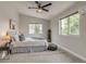 Bright bedroom featuring neutral walls, ceiling fan, and plush carpet at 3937 Osceola St, Denver, CO 80212