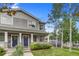 Inviting two-story home features a well-manicured lawn and front yard landscaping at 3937 Osceola St, Denver, CO 80212