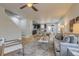 An open floor plan featuring hardwood floors, a gray sofa, and a modern kitchen at 3937 Osceola St, Denver, CO 80212