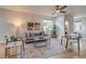 Bright living room with hardwood floors, contemporary decor, and a comfortable gray sofa at 3937 Osceola St, Denver, CO 80212