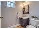 Powder room featuring a floating vanity, framed mirror with shelves, and modern toilet at 3937 Osceola St, Denver, CO 80212