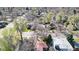 Aerial view of a neighborhood with mature trees and various home styles at 2572 S Vine St, Denver, CO 80210