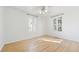 Spacious bedroom with hardwood floors and plenty of natural light from two windows at 2572 S Vine St, Denver, CO 80210