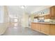 Cozy kitchen area with ceiling fan transitions into a bright living space, perfect for modern living at 2572 S Vine St, Denver, CO 80210