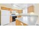 Functional kitchen features plenty of counter space and storage, with ample natural light and essential appliances at 2572 S Vine St, Denver, CO 80210