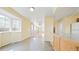 Open concept living space flows to kitchen with big windows, filling the area with lots of natural light at 2572 S Vine St, Denver, CO 80210