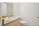 Bright bathroom featuring a single sink vanity, toilet, and shower/tub combo at 250 N Pearl St # 310, Denver, CO 80203