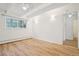 Bedroom featuring wood-look floors, brick accent wall and sconces at 250 N Pearl St # 310, Denver, CO 80203