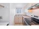 Well-lit kitchen with stainless appliances and plenty of cabinet space at 250 N Pearl St # 310, Denver, CO 80203