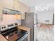 Efficient kitchen with stainless appliances and a view to the living room at 250 N Pearl St # 310, Denver, CO 80203
