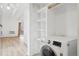 Convenient laundry area with shelving and washer at 250 N Pearl St # 310, Denver, CO 80203