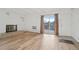 Cozy living room features hardwood floors, decorative fireplace, and sliding glass doors at 250 N Pearl St # 310, Denver, CO 80203