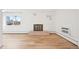 Bright living room with hardwood floors and decorative fireplace at 250 N Pearl St # 310, Denver, CO 80203