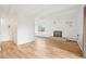 Bright living room features hardwood floors, a decorative fireplace, and large windows with city views at 250 N Pearl St # 310, Denver, CO 80203