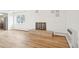Open-concept living room with decorative fireplace, hardwood floors and view of the kitchen at 250 N Pearl St # 310, Denver, CO 80203