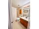 Well-lit bathroom with a shower-tub combo, vanity, and decorative elements at 6899 Countryside Ln # 269, Niwot, CO 80503