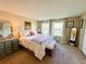Cozy bedroom with plush carpet, neutral walls, and inviting natural light from the large windows at 6899 Countryside Ln # 269, Niwot, CO 80503