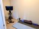 Functional exercise room with stationary bike, dumbbells, yoga mat, and foam rollers, perfect for home workouts at 6899 Countryside Ln # 269, Niwot, CO 80503