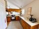 Inviting kitchen featuring oak cabinets, updated appliances, and bright lighting at 6899 Countryside Ln # 269, Niwot, CO 80503