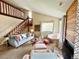 Inviting living room with plush seating, staircase, and a cozy atmosphere at 6899 Countryside Ln # 269, Niwot, CO 80503