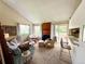 Open living room with comfortable seating, fireplace, bar and natural light at 6899 Countryside Ln # 269, Niwot, CO 80503