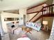 Cozy living room with comfortable seating, staircase, and a stylish bar at 6899 Countryside Ln # 269, Niwot, CO 80503