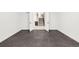 Open room with dark flooring and a view of the stairs and wet bar. Plenty of space to customize for your needs at 1466 S Gaylord St, Denver, CO 80210