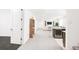 Finished basement with a wet bar, shelving, and a large living area at 1466 S Gaylord St, Denver, CO 80210