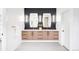 Bright bathroom with double sinks, modern fixtures, and a plant at 1466 S Gaylord St, Denver, CO 80210