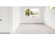 Bright bedroom features neutral carpet, white walls and trim, and a large window at 1466 S Gaylord St, Denver, CO 80210