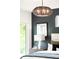 Relaxing bedroom with an accent wall and modern lighting at 1466 S Gaylord St, Denver, CO 80210