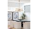Dining area featuring modern decor, a sleek black table, and views of outdoor landscape at 1466 S Gaylord St, Denver, CO 80210