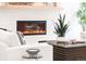 Close-up of a sleek, modern fireplace surrounded by neutral decor in a contemporary living room at 1466 S Gaylord St, Denver, CO 80210