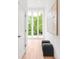 Bright hallway featuring natural light and minimalist decor, creating a welcoming transition space at 1466 S Gaylord St, Denver, CO 80210