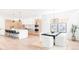 Open-concept layout showcases modern design with a combined kitchen and dining space, maximizing flow and light at 1466 S Gaylord St, Denver, CO 80210