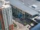 Aerial view of a convention center featuring a large blue bear statue in front of the building at 891 14Th St # 3411, Denver, CO 80202
