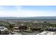 Scenic city view with buildings, greenery, and a distant mountain range under a blue sky at 891 14Th St # 3411, Denver, CO 80202