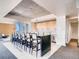 Large dining area with an island, long bar and eating space and modern lighting at 891 14Th St # 3411, Denver, CO 80202