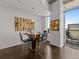 Dining area with a glass table, city views, and modern decor at 891 14Th St # 3411, Denver, CO 80202