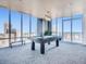 Game room with a pool table, floor-to-ceiling windows and spectacular city views at 891 14Th St # 3411, Denver, CO 80202