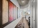 Hallway showcasing artwork and leading to a kitchen area with bar seating at 891 14Th St # 3411, Denver, CO 80202