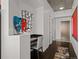 Hallway featuring a desk area, modern art pieces, and access to other rooms at 891 14Th St # 3411, Denver, CO 80202