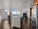 Modern kitchen with stainless steel appliances, island with seating, and expansive city views at 891 14Th St # 3411, Denver, CO 80202