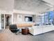 Well-lit living room featuring a large flat screen television and comfortable seating at 891 14Th St # 3411, Denver, CO 80202