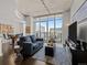 Stylish living room with floor-to-ceiling windows, city views, and contemporary furnishings at 891 14Th St # 3411, Denver, CO 80202