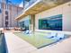 Amazing rooftop pool deck with lounge chairs in the water and great city views at 891 14Th St # 3411, Denver, CO 80202